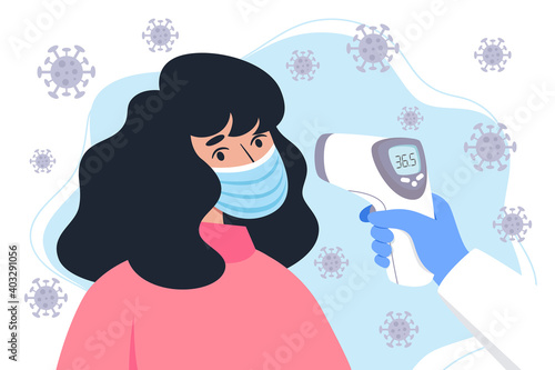 Checking body temperature with an infrared thermometer