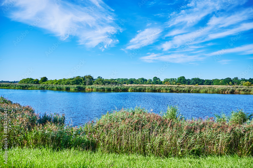View over the banks of the river Ryck in Northern Germany. View over the banks of the river Ryck in Northern Germany.