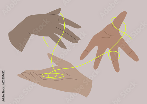 Human hands of different skin color passing a neon thread, the international community, diversity