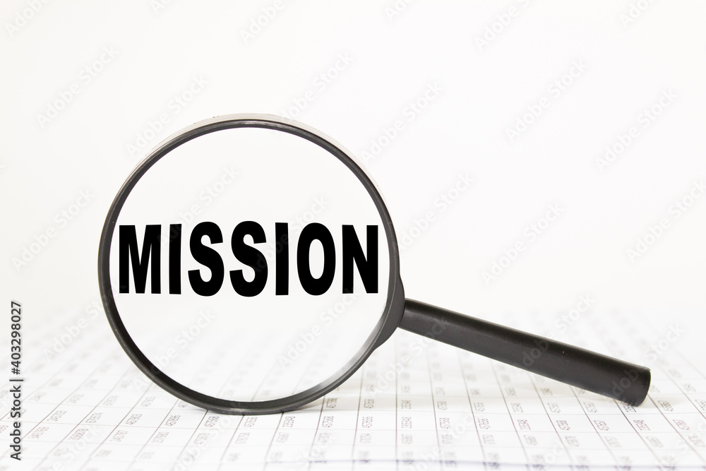 words MISSION in a magnifying glass on a white background. business concept words MISSION in a magnifying glass on a white background. business concept