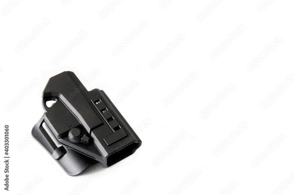 Closeup of a polymer pistol holster on a white background. Outside the Waistband holster - OWB. Closeup of a polymer pistol holster on a white background. Outside the Waistband holster - OWB.