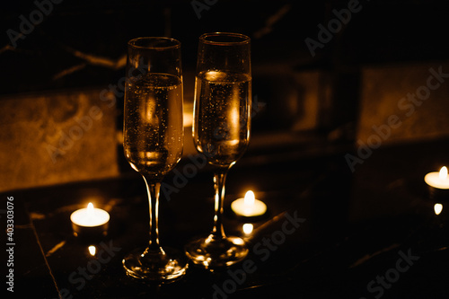 Celebration.Glasses of wine. The concept of Valentine's Day. Bokeh in the background of glasses are shaped like heart.