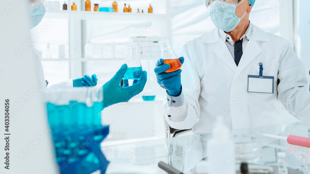 scientists and doctors work in a modern laboratory. scientists and doctors work in a modern laboratory.