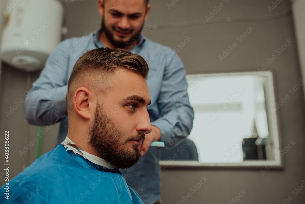 Fototapeta premium Hipster client visiting barber shop 