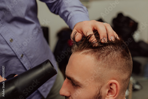 Hipster client visiting barber shop 