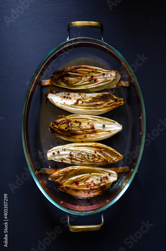 Overhead vieuw of oven baked chicory of endives on a fire fixed dish,casserole.  photo