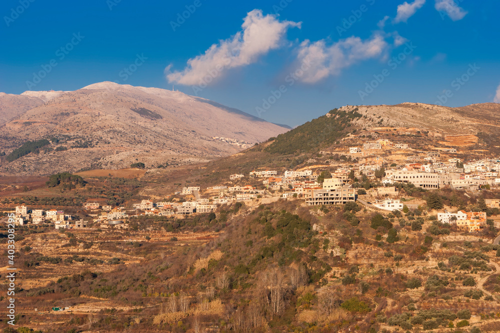 Fototapeta premium View On Majdal Shams The Druze town in the southern foothills of Mountain Hermon, At Sunset, Golan Heights, Israel