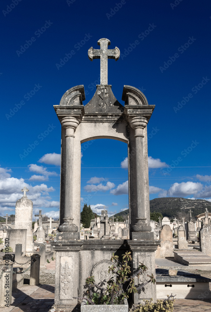 A beautiful view of a cemetery graveyard with tombstones crosses and angels at llucmajor in mallorca island balearic spain on a clear sunny day A beautiful view of a cemetery graveyard with tombstones crosses and angels at llucmajor in mallorca island balearic spain on a clear sunny day