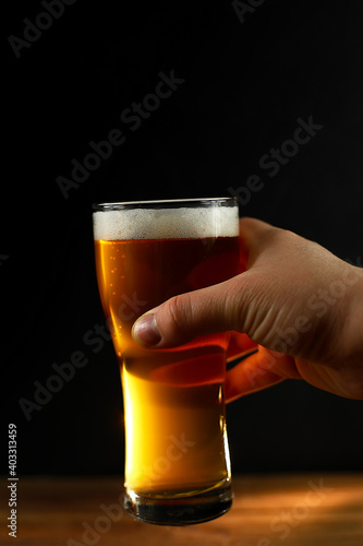 glass of beer in hand
