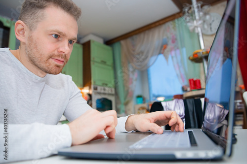 young man working on laptop home office. concept of remote work on Internet