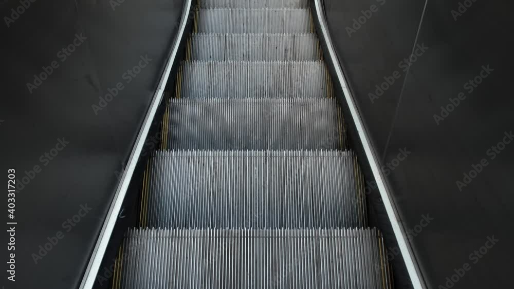 The escalator, with a first-person perspective. The descending escalators The escalator, with a first-person perspective. The descending escalators