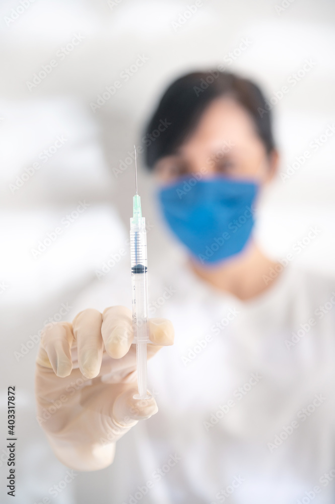 Syringe, medical injection in hand. Vaccination kit. Nurse with syringe. Covid-19 vaccine campaign. Covid-19 vaccination concept. Syringe, medical injection in hand. Vaccination kit. Nurse with syringe. Covid-19 vaccine campaign. Covid-19 vaccination concept.