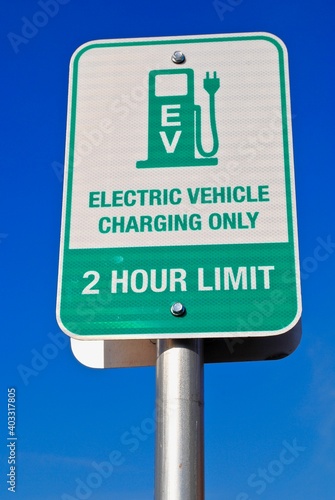 California, USA - 2019: Electronic Vehicle charging station sign. EV charging only 2 hour limit. Also called EV charging station, electric recharging point, charge point, ECS or EVSE.