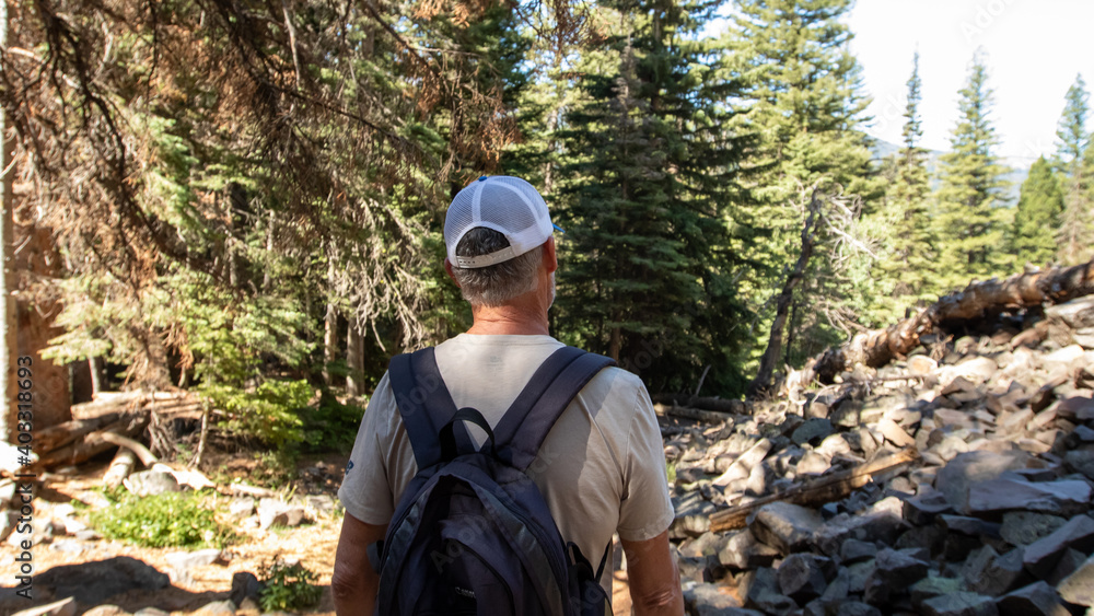 Man on a Hike in Big Sky, Montana, Hiking in the Mountains Man on a Hike in Big Sky, Montana, Hiking in the Mountains