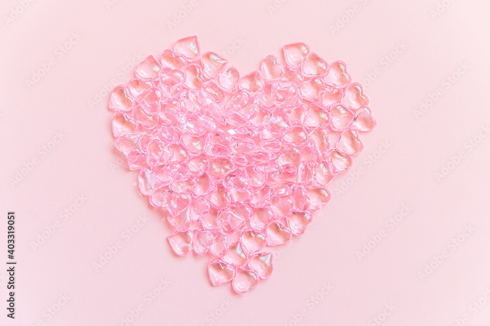 St. Valentine's Day concept. Heart shaped objects many pink hearts isolated on pink pastel background. Postcard banner on valentines day. Love date lovesick wedding romance symbol. Top view, flat lay