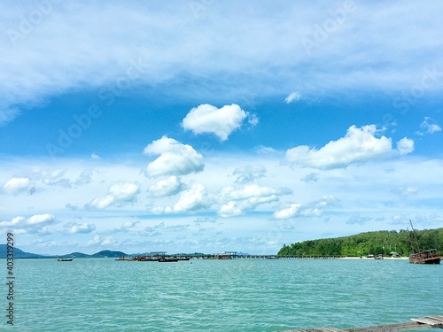 The landscape of the sea, the beautiful sky with many shapes of could, clearly mangrove sea, forest, fish cage and island in relax mode, Phuket Thailand.