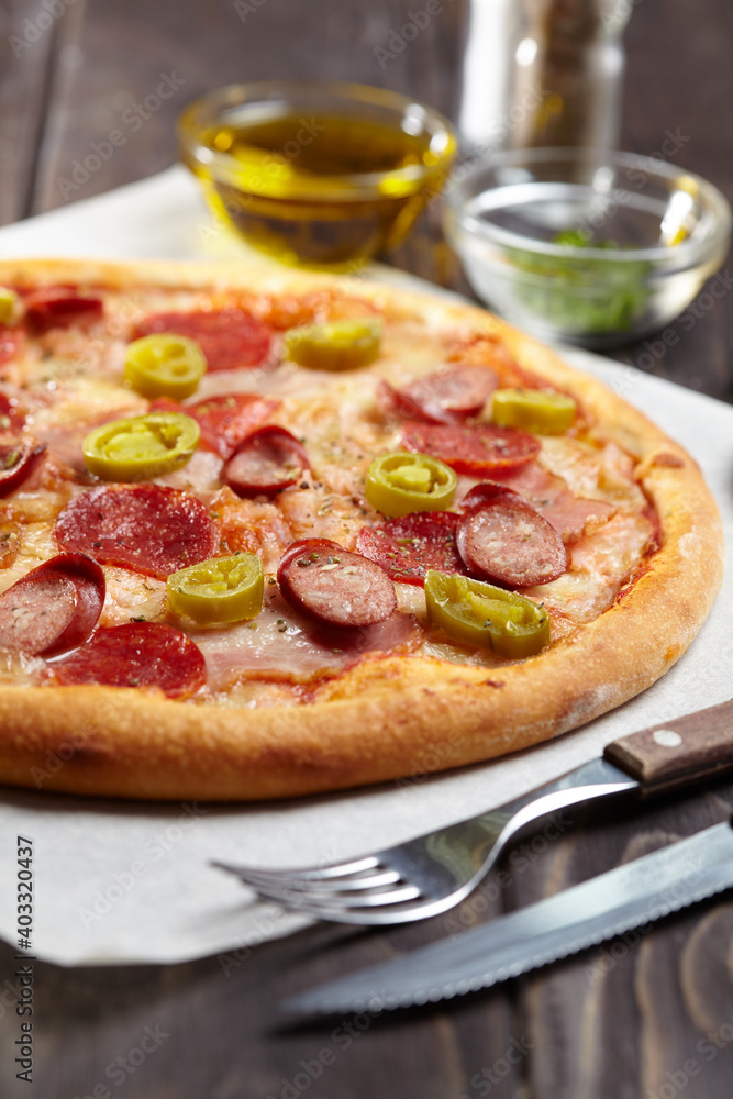 tasty pizza on the wooden background tasty pizza on the wooden background
