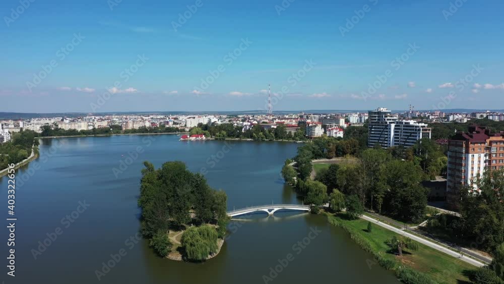 Big public lake in the central park of the Ivano-Frankovsk city aerial view. Big public lake in the central park of the Ivano-Frankovsk city aerial view.