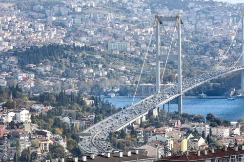 15th July Martyrs Bridge (in Turkish 15 Temmuz Sehitler Koprusu ) Bosphorus Bridge, Istanbul, Turkey with panoramic view of the city. Traffic in Istanbul