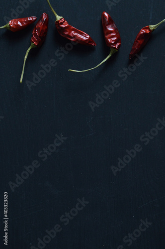 bunch of chili pepper on the top on black background
