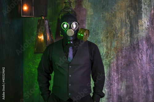 cosplay of a guy in a gas mask on a green background with glowing eyes