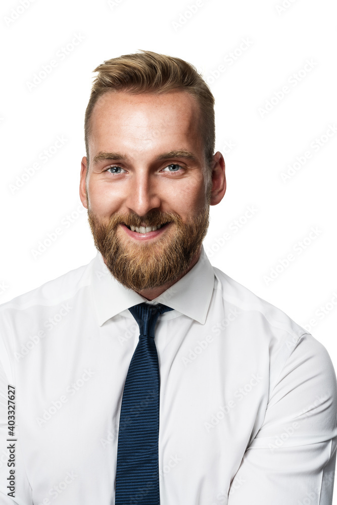 Portrait of a handsome businessman wearing a white shirt and blue tie looking directly at camera. White background. Portrait of a handsome businessman wearing a white shirt and blue tie looking directly at camera. White background.