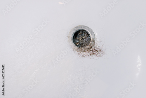 Canvas Print Photo of a dirty drain of a bath tub and full of hair .