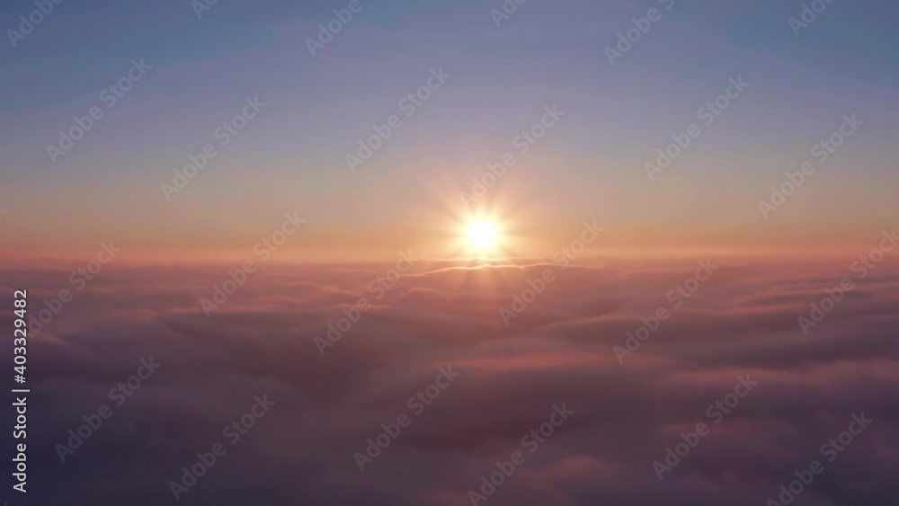Beautiful sky above clouds with dramatic light at sunrise from aerial view. Beautiful sky above clouds with dramatic light at sunrise from aerial view.