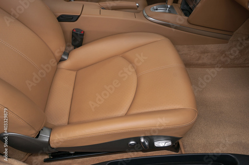 Modern car interior background. Passenger leather seat. © alexdemeshko