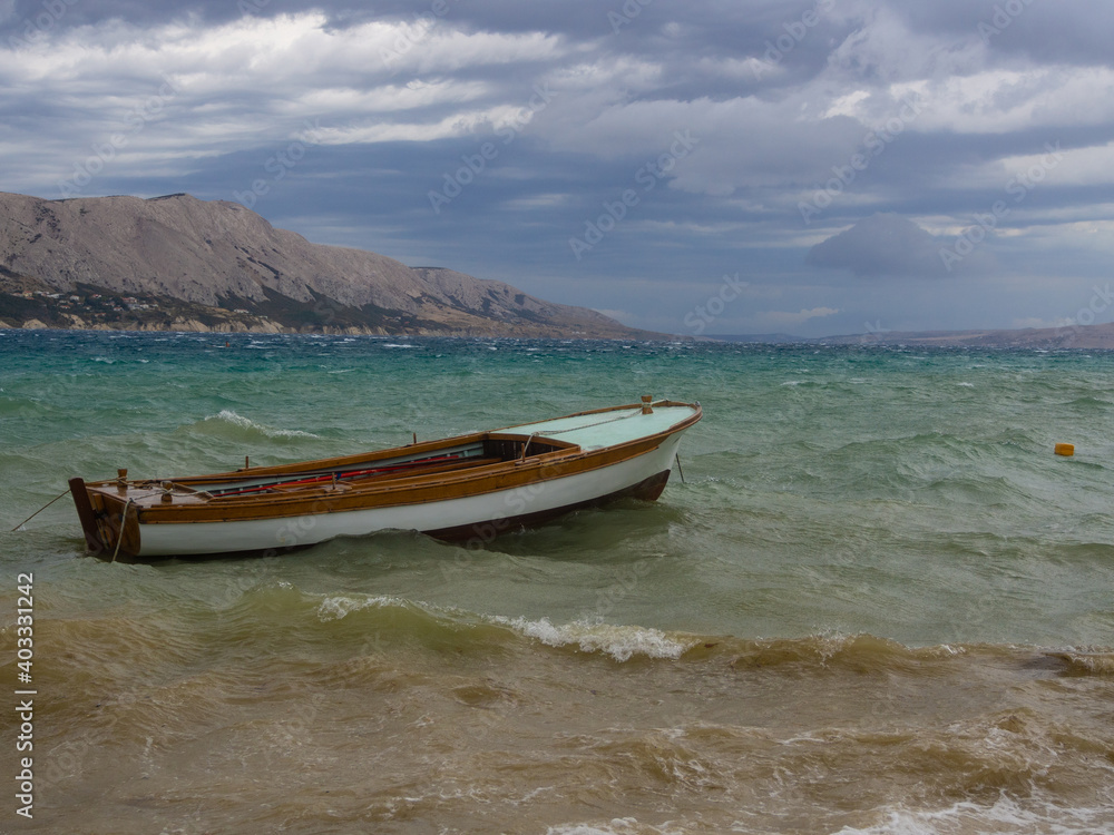 A boat on the waves.