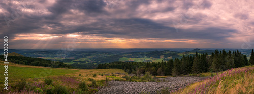 Panoramic view from Wasserkuppe mountain in Rhoen on cloudy summer evening