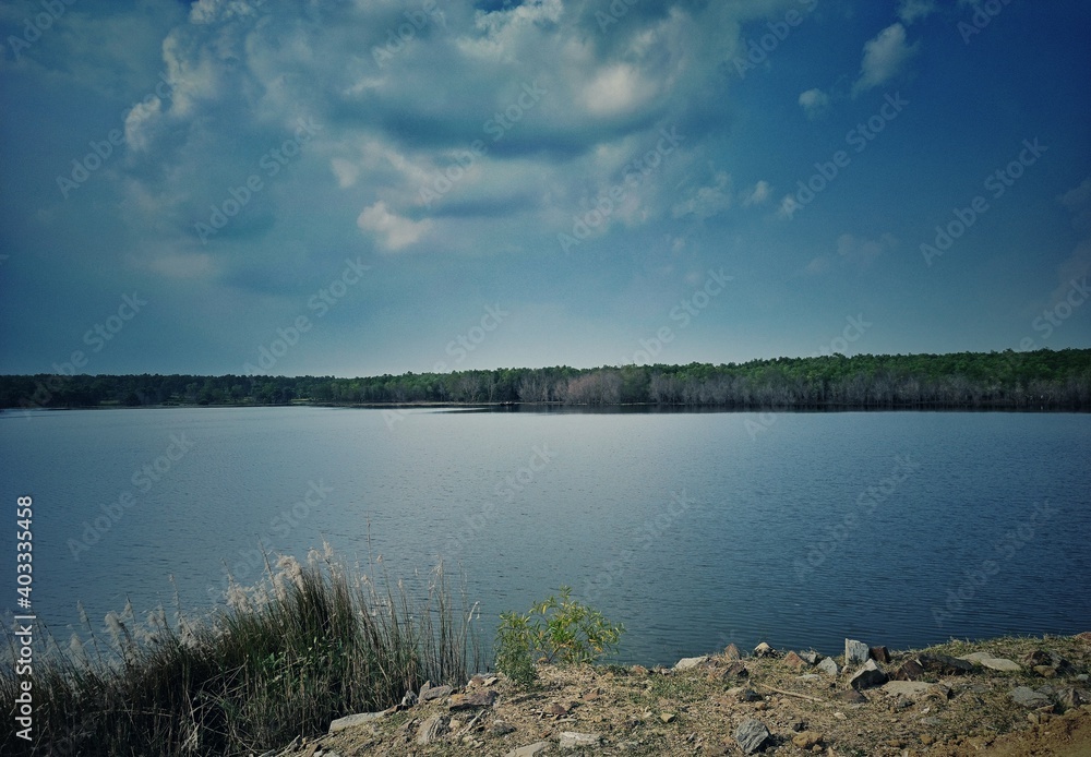 PURULIA, West Bengal, India- 24th October 2020.  A beautiful landscape at its best with  cloud in the sky, green forest, crystal clear water of lake