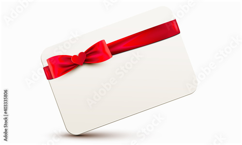 Card wrapped with red ribbon and heart appliqué tight into a elegant bow
