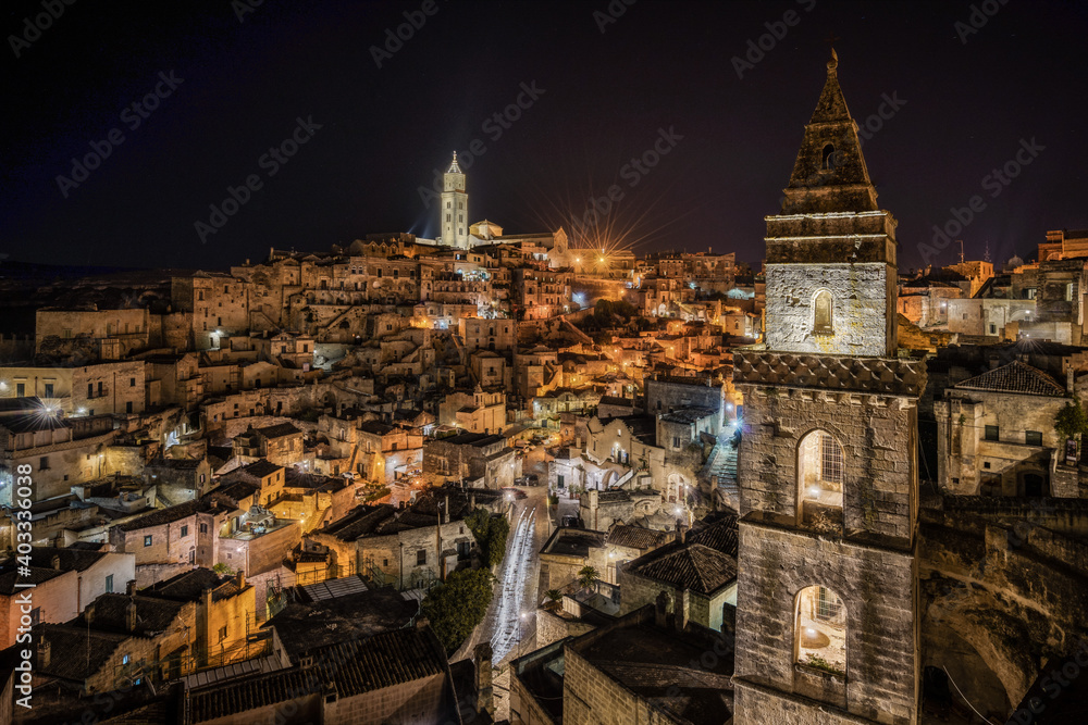 Night cityscape of Matera old town viewed from Sasso Barisano, Basilicata, Italy