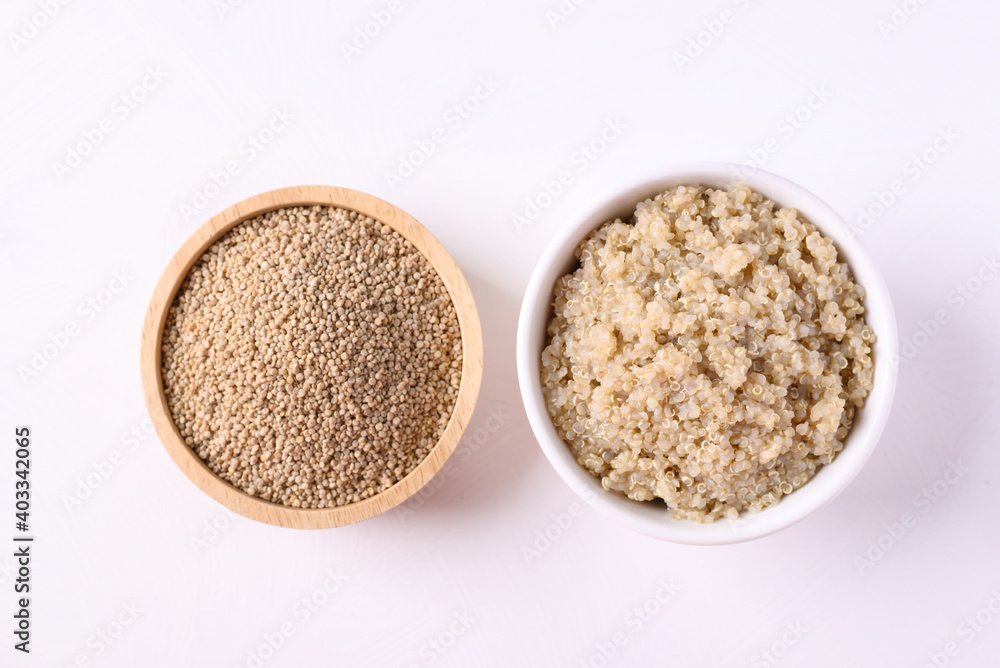 Cooked brown quinoa seeds and raw quinoa seeds in a bowl on white background, Healthy vegan food Cooked brown quinoa seeds and raw quinoa seeds in a bowl on white background, Healthy vegan food