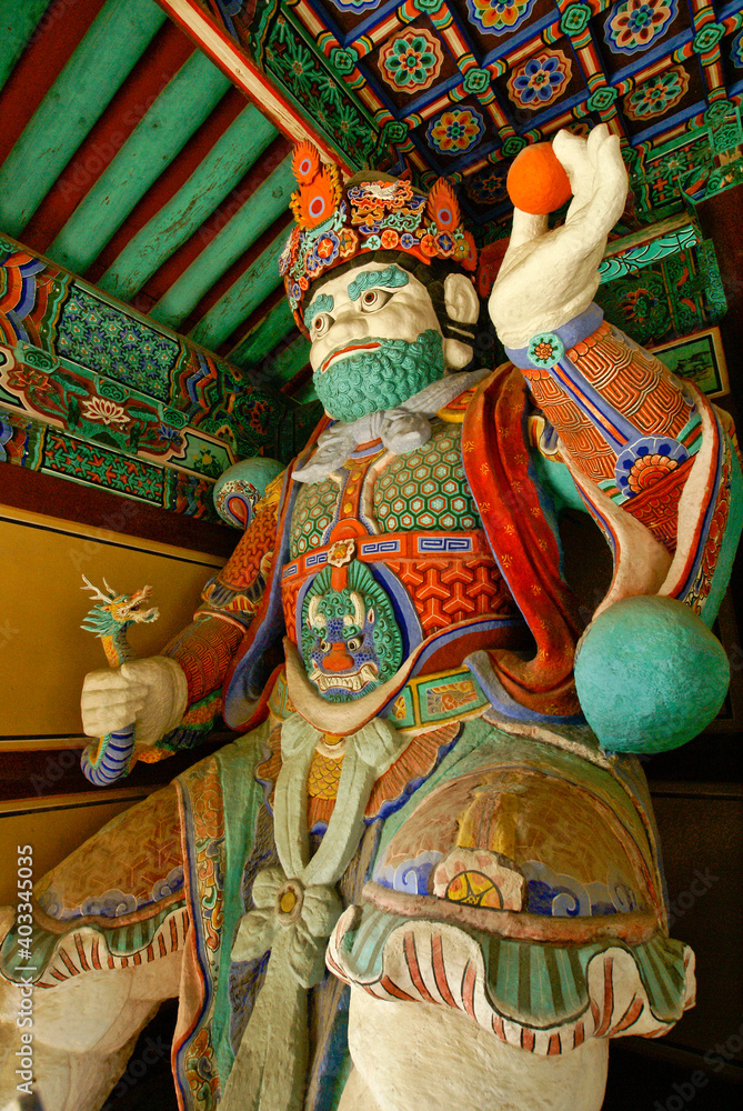 Near Gyeongju, a temple guardian decorates an entryway at Girimsa, South Korea's second largest Buddhist temple.