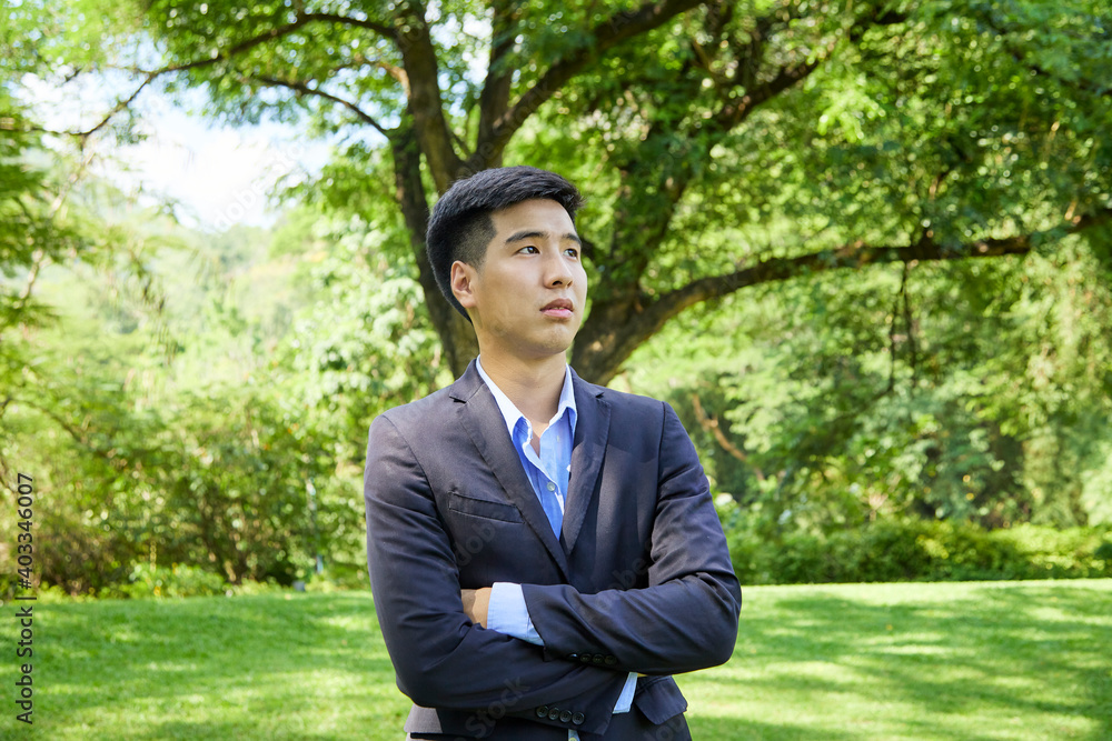 Young businessman relaxing in the garden Young businessman relaxing in the garden