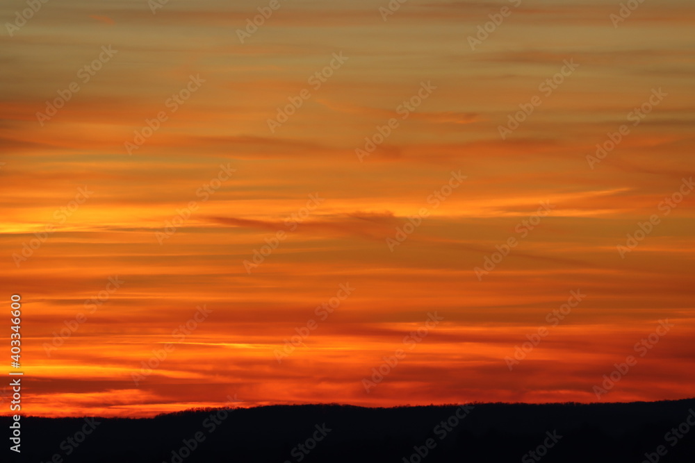 Winter sunset with hues of yellow, orange and red
