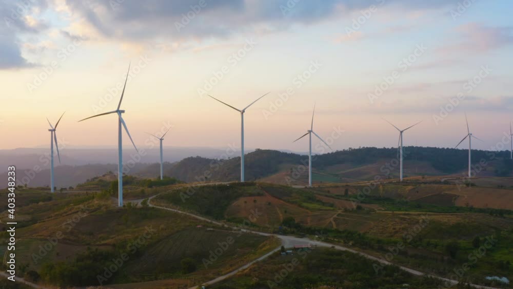 Aerial view of windmill farm for electricity production. Wind power turbines generating clean renewable energy for sustainable Aerial view of windmill farm for electricity production. Wind power turbines generating clean renewable energy for sustainable