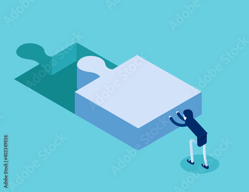 A woman pushes the puzzle to the right position