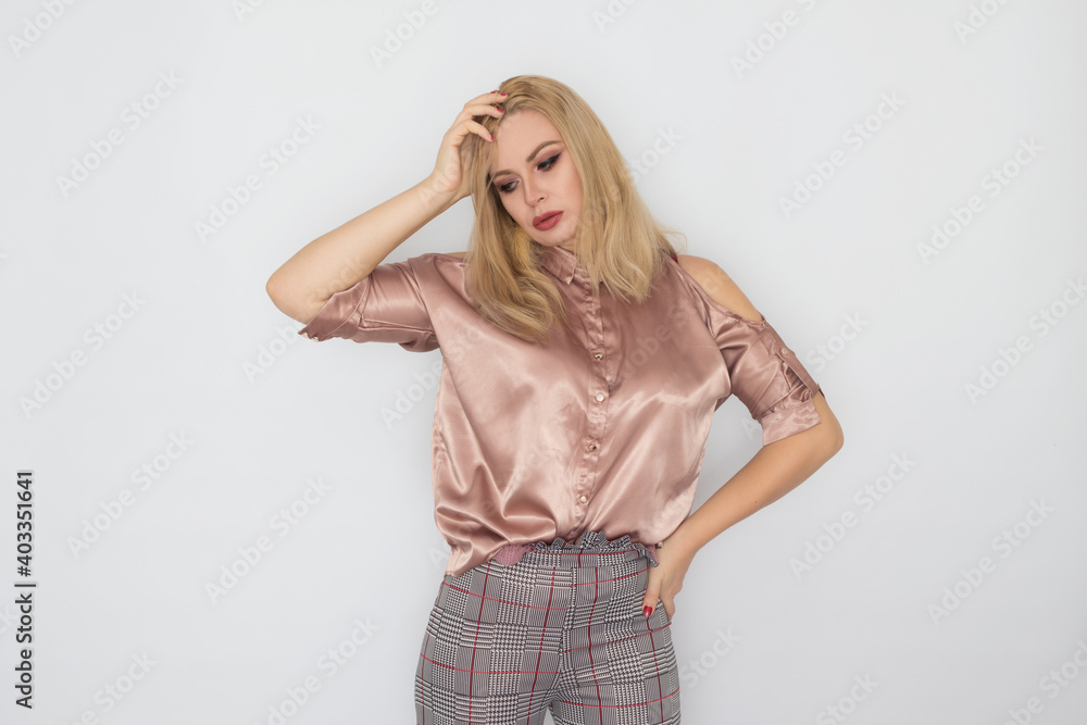 Smiling blonde business woman in pink blouse Smiling blonde business woman in pink blouse