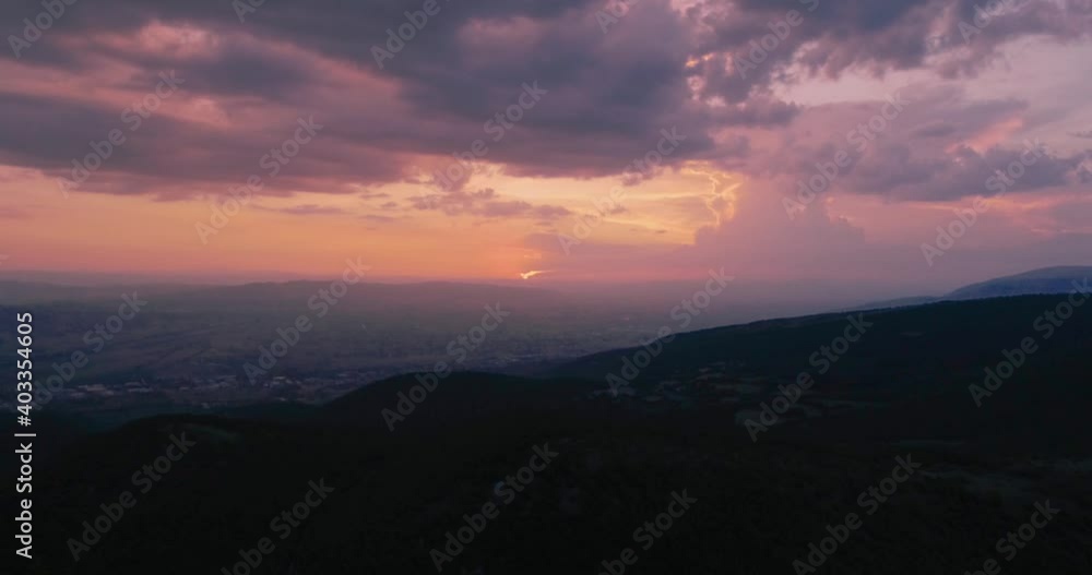 Aerial drone view of the sunset with colorful red, orange, and pink clouds, relaxing and exciting sunset perfect for romantic scenes Aerial drone view of the sunset with colorful red, orange, and pink clouds, relaxing and exciting sunset perfect for romantic scenes