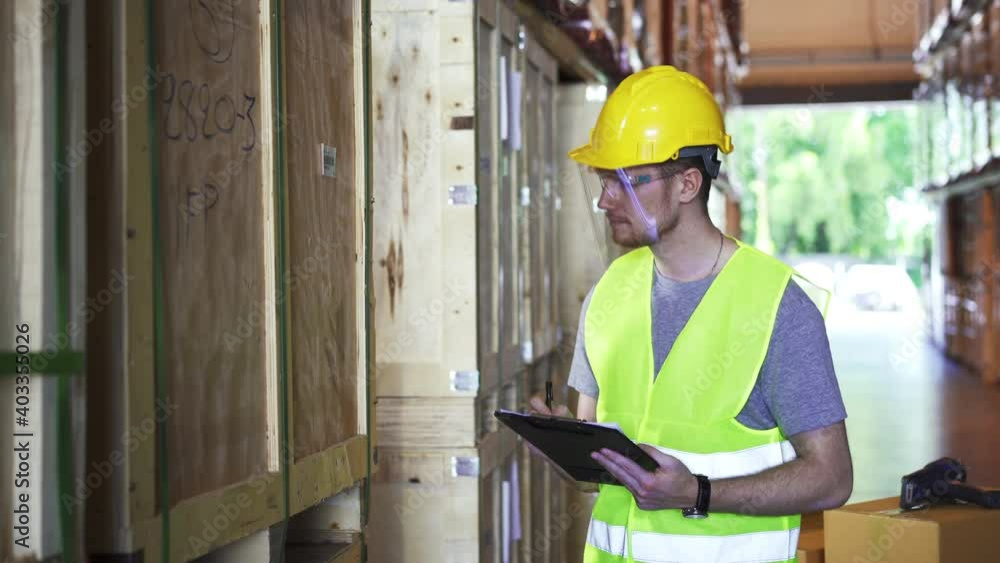 Male warehouse worker wearing hard hats walking and checks goods inventory stock on goods shelf in distribution fulfillment center. eCommerce business and freight transportation logistic concept.
Male warehouse worker wearing hard hats walking and checks goods inventory stock on goods shelf in distribution fulfillment center. eCommerce business and freight transportation logistic concept.