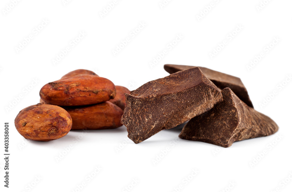 Cocoa beans with cocoa pieces isolated on a white background. Macro photography. Cocoa beans with cocoa pieces isolated on a white background. Macro photography.