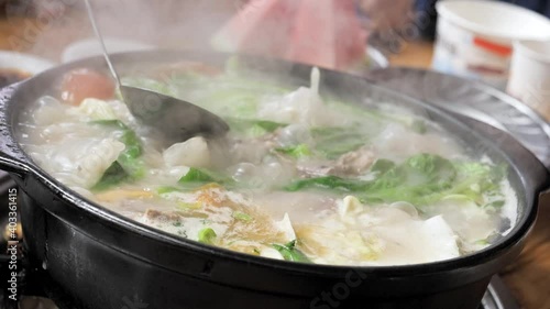 Slow Motion Chinese Hot Pot Boiling, Yunnan, China photo