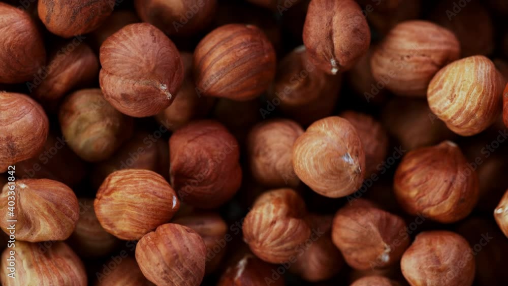 Super Slow Motion Detail Shot of Flying and Rotating Hazelnuts at 1000 fps. Super Slow Motion Detail Shot of Flying and Rotating Hazelnuts at 1000 fps.