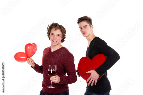 Holidays and weekends. Young attractive couple drinking red wine. White background.