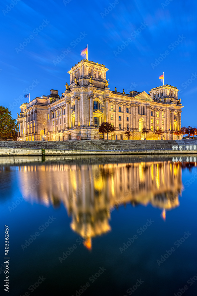 The Reichstag at the river Spree in Berlin at dawn
