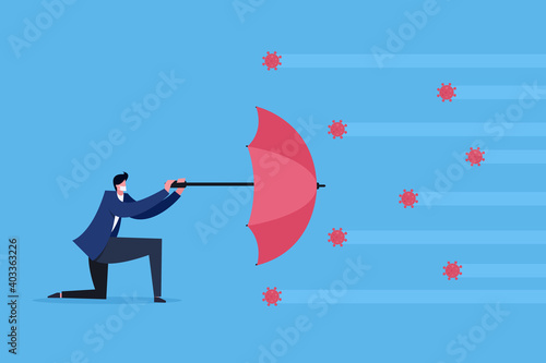 A businessman wearing mask uses an umbrella to shield the attack of the virus