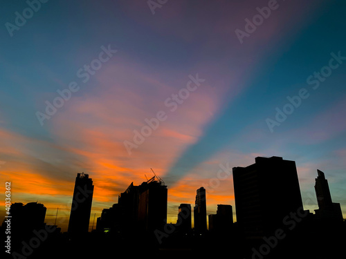 Aerial view cityscape of modern city at sunset in Bangkok, Thailand.